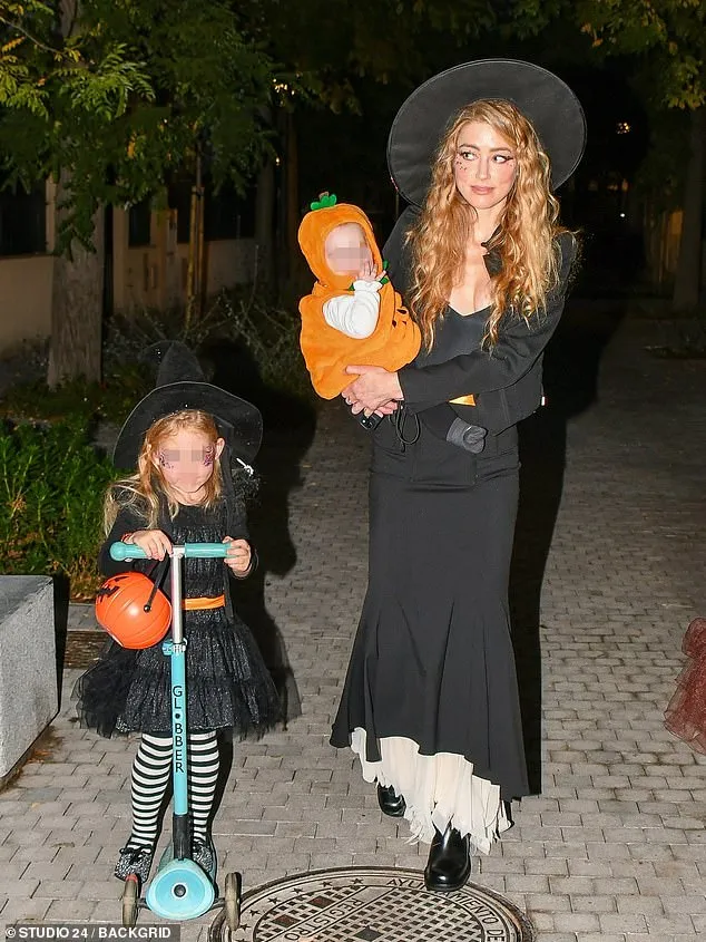 Amber Heard seen with twins for the first time as she goes trick-or-treating in Madrid after fleeing US | Daily Mail Online